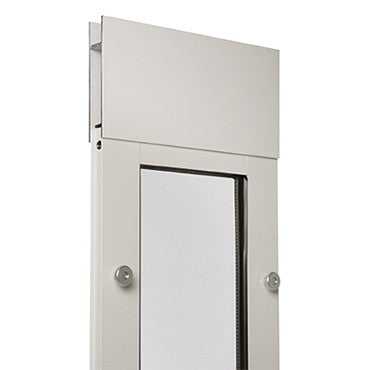 Close-up of a white metal cabinet with a framed window.