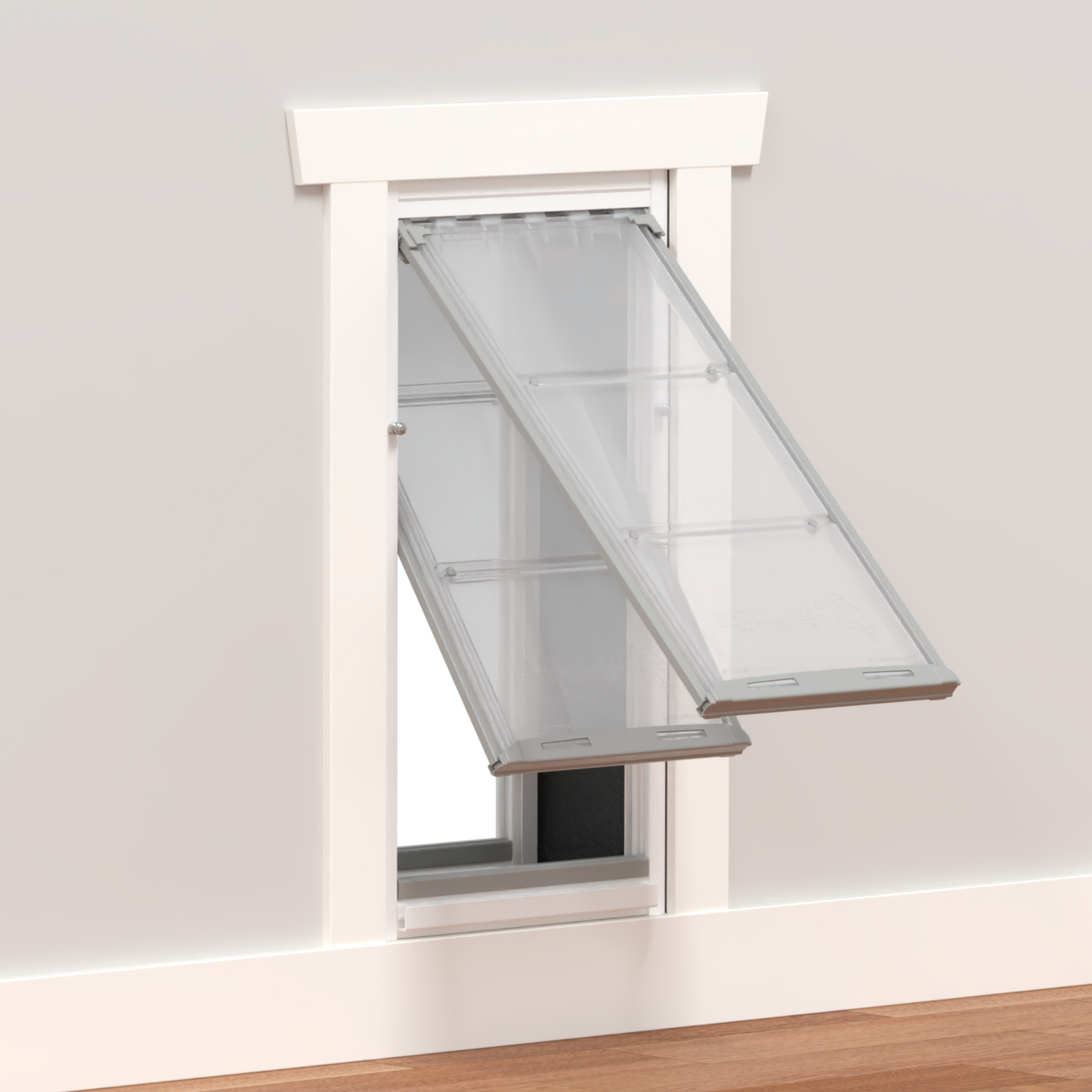 A pet door with clear flaps installed in a wall._Color_White
