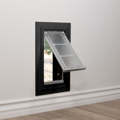 A pet door is installed in a wall.