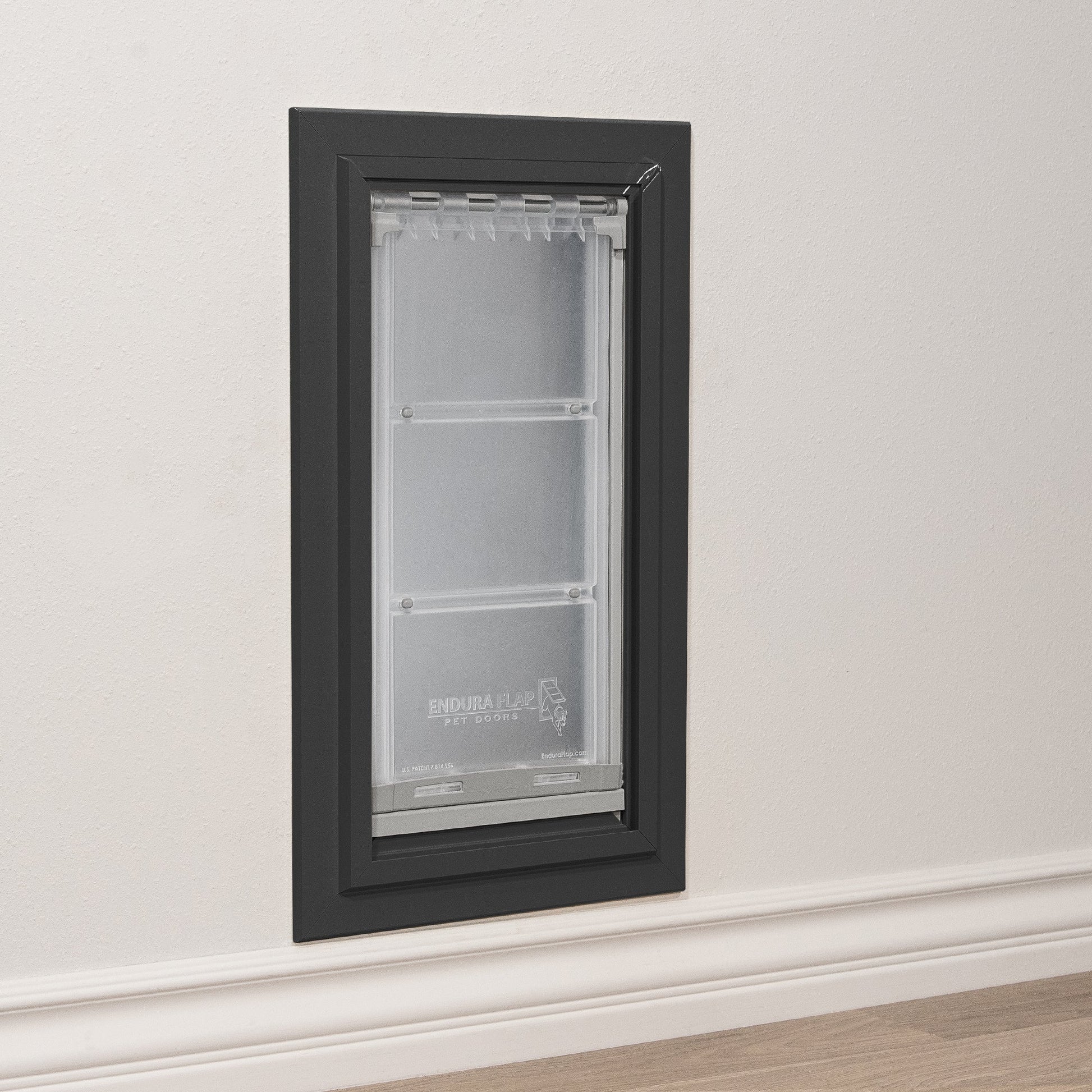 An Endura Flap pet door installed in a wall.