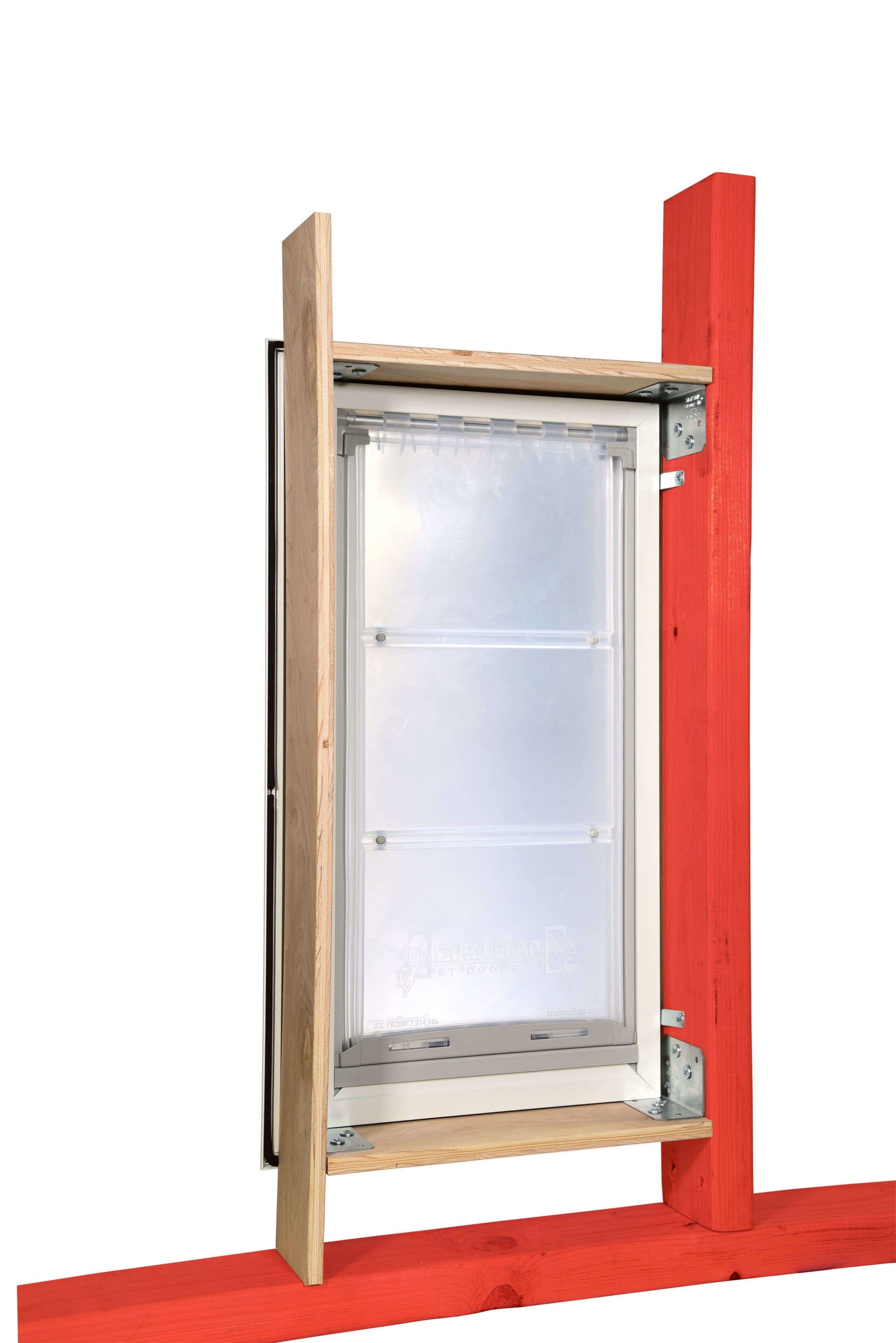 A pet door is installed in a framed opening.
