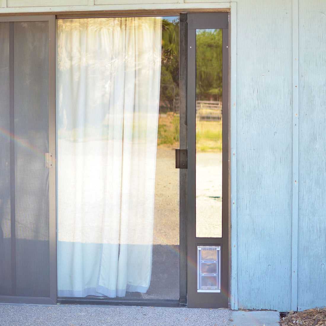 Sliding glass door with a dog door insert.