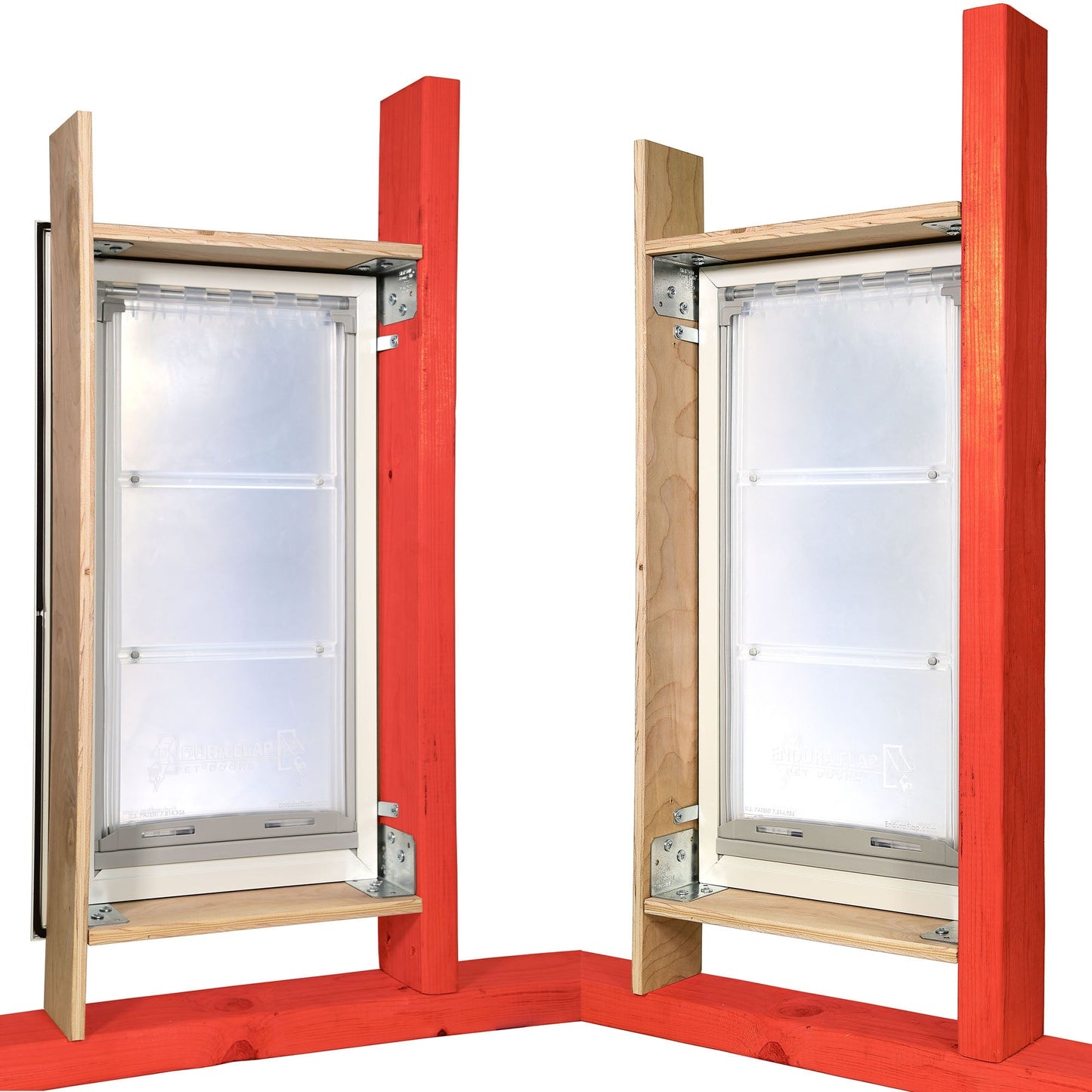 Two pet doors with flexible flaps are mounted within a wooden frame.