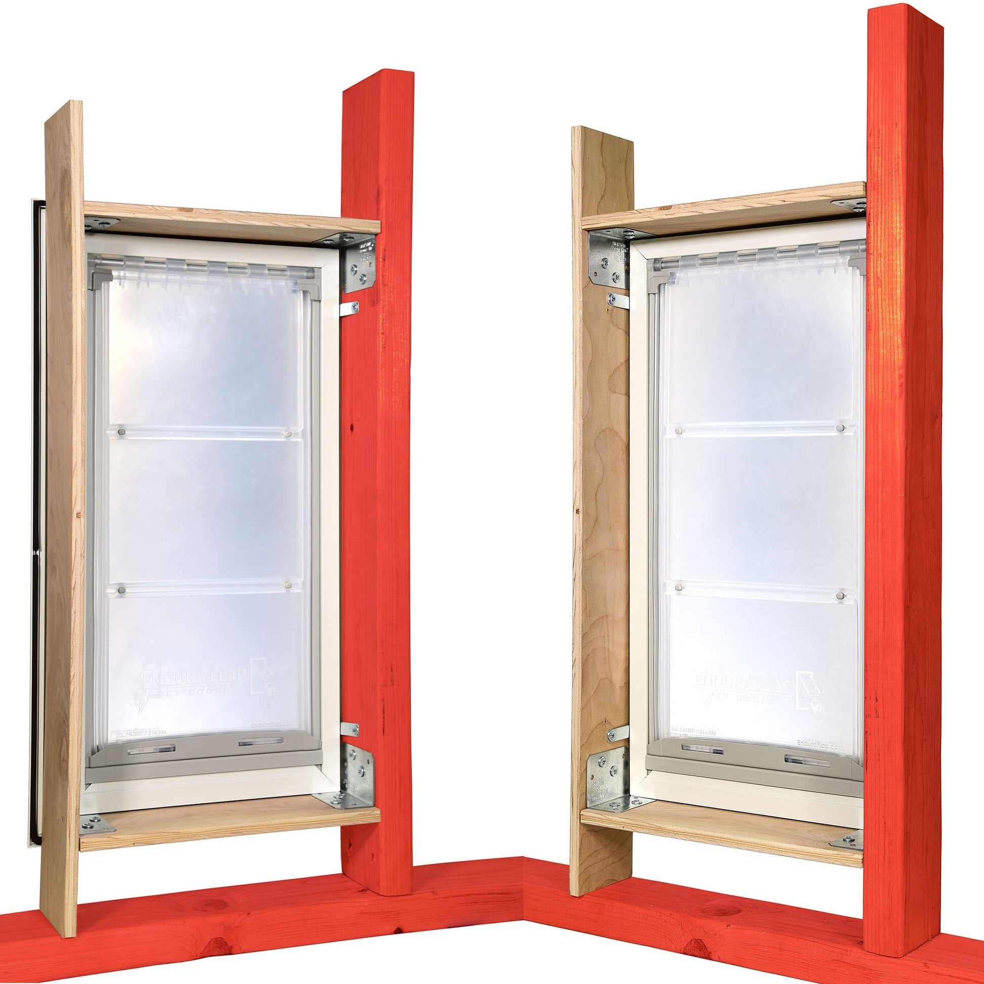Two pet doors with flexible flaps are mounted within a wooden frame.